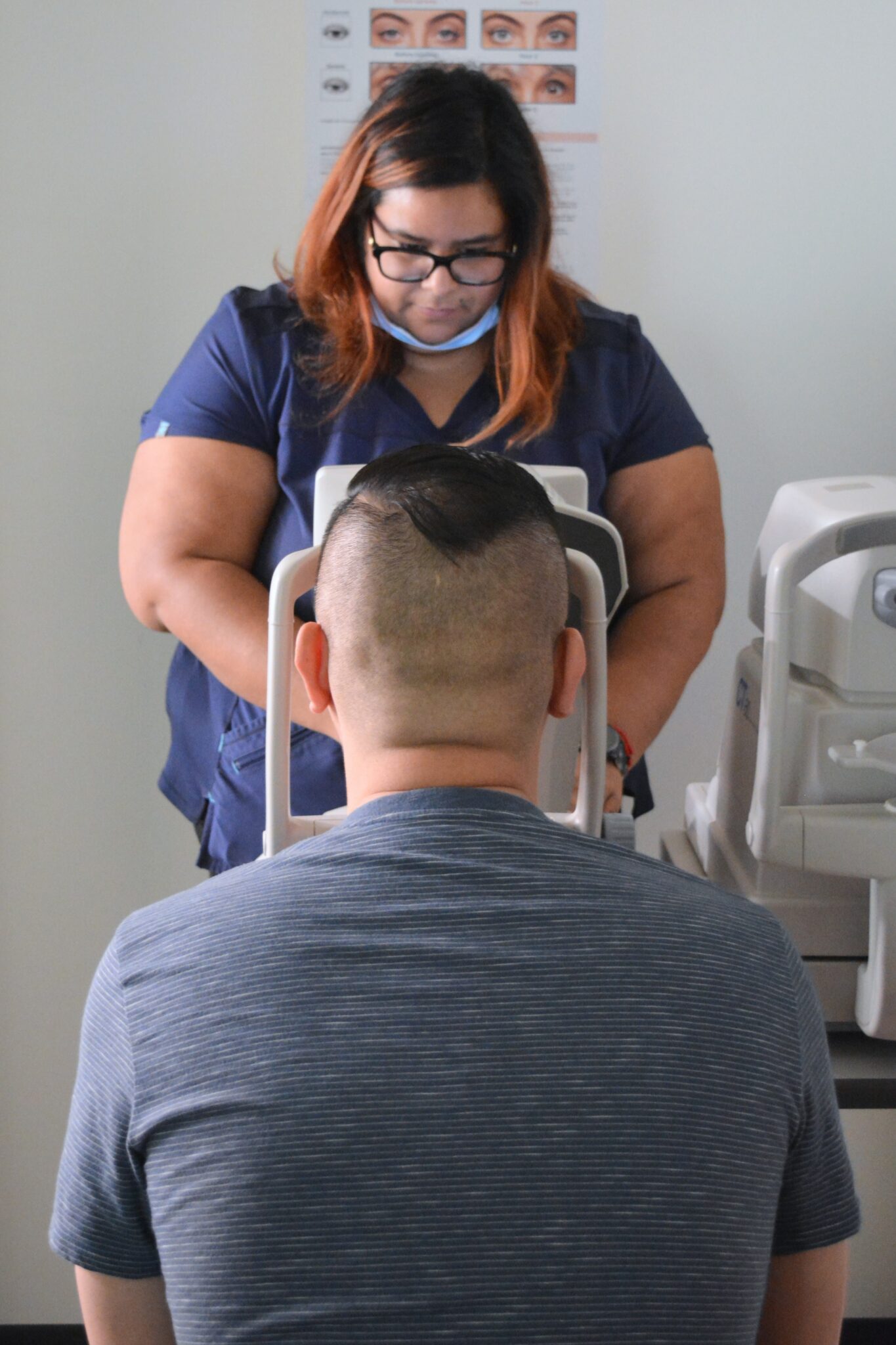 A photo of an eye exam being performed